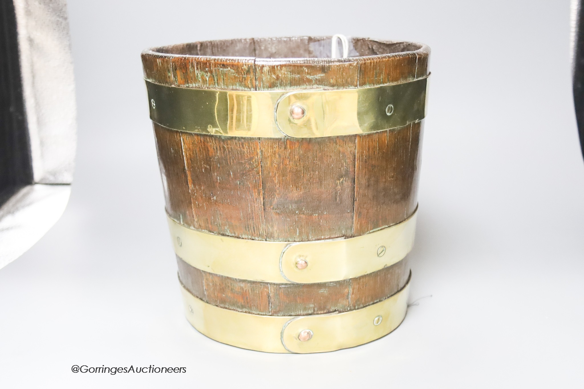 An 18th century brass-bound oak peat bucket, height 23cm